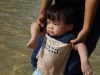 Izaac standing in the water   